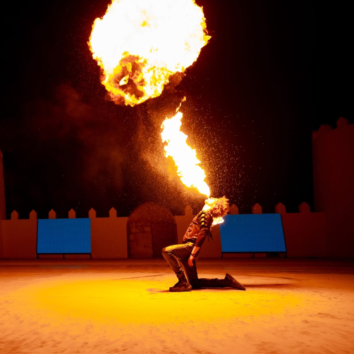 Dancing with the fire at Nujum Desert Camp, Sunset safari experience
