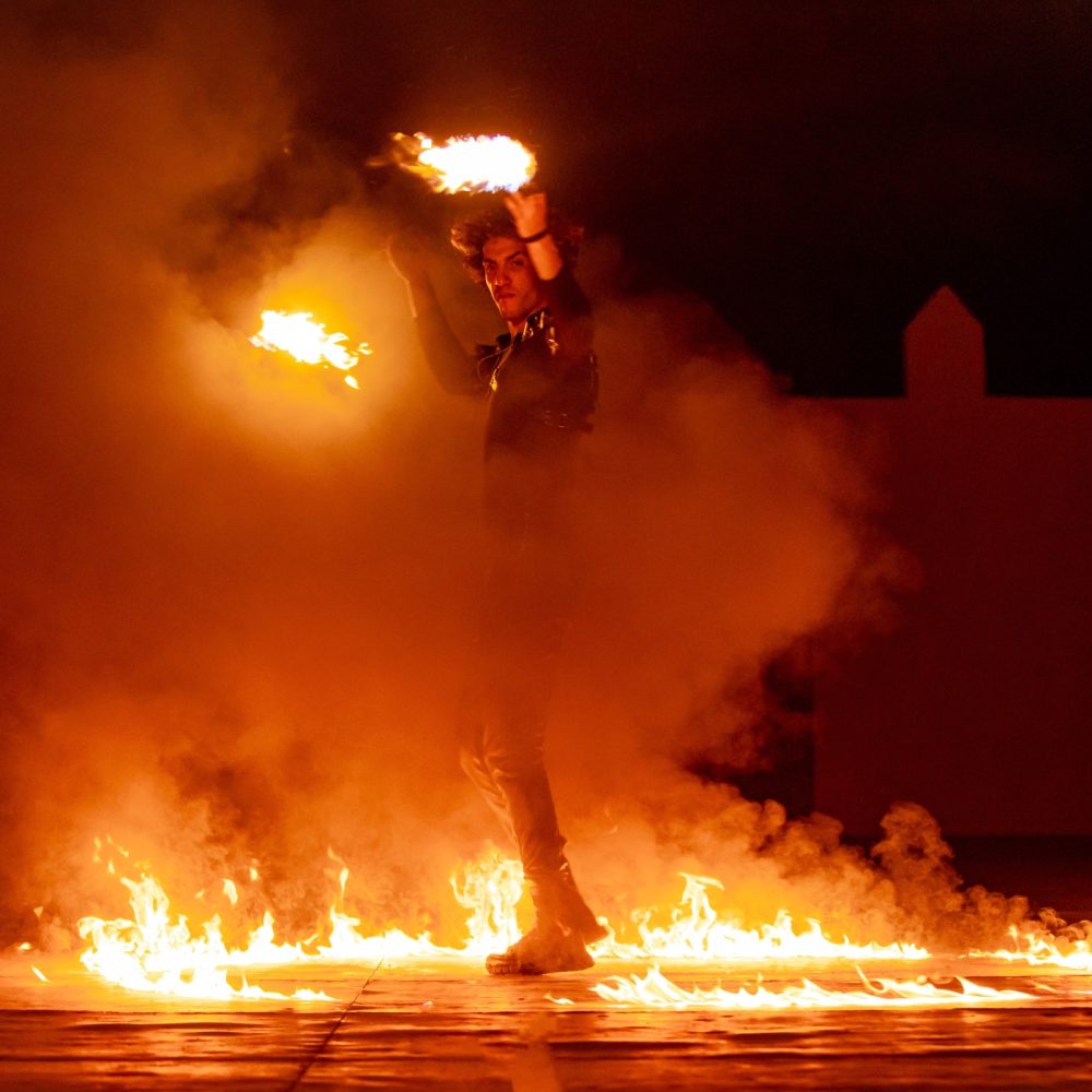 Dancing with the fire at Nujum Desert camp, sunset safari experience